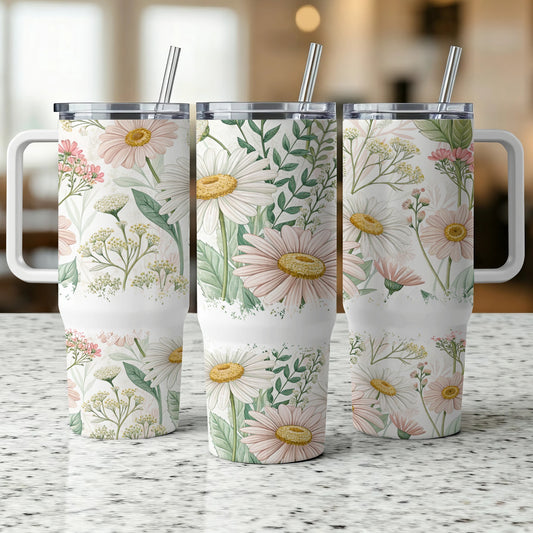 Three white tumblers with daisy and greenery floral pattern.