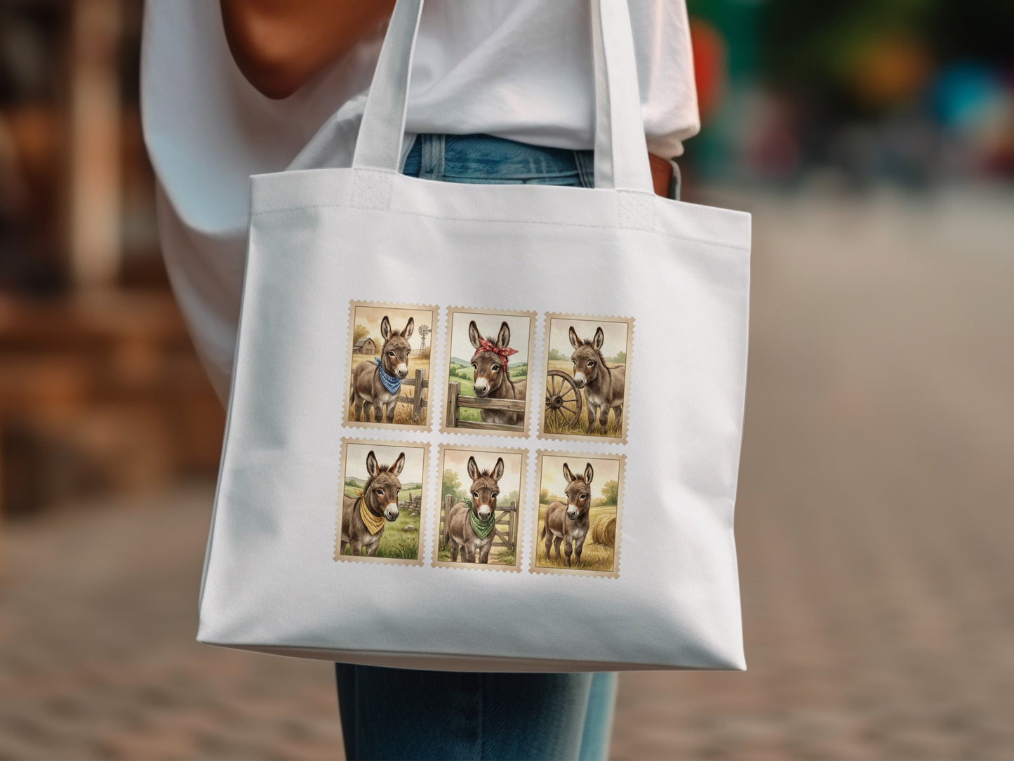 White tote bag with six postage stamp-style images of donkeys.