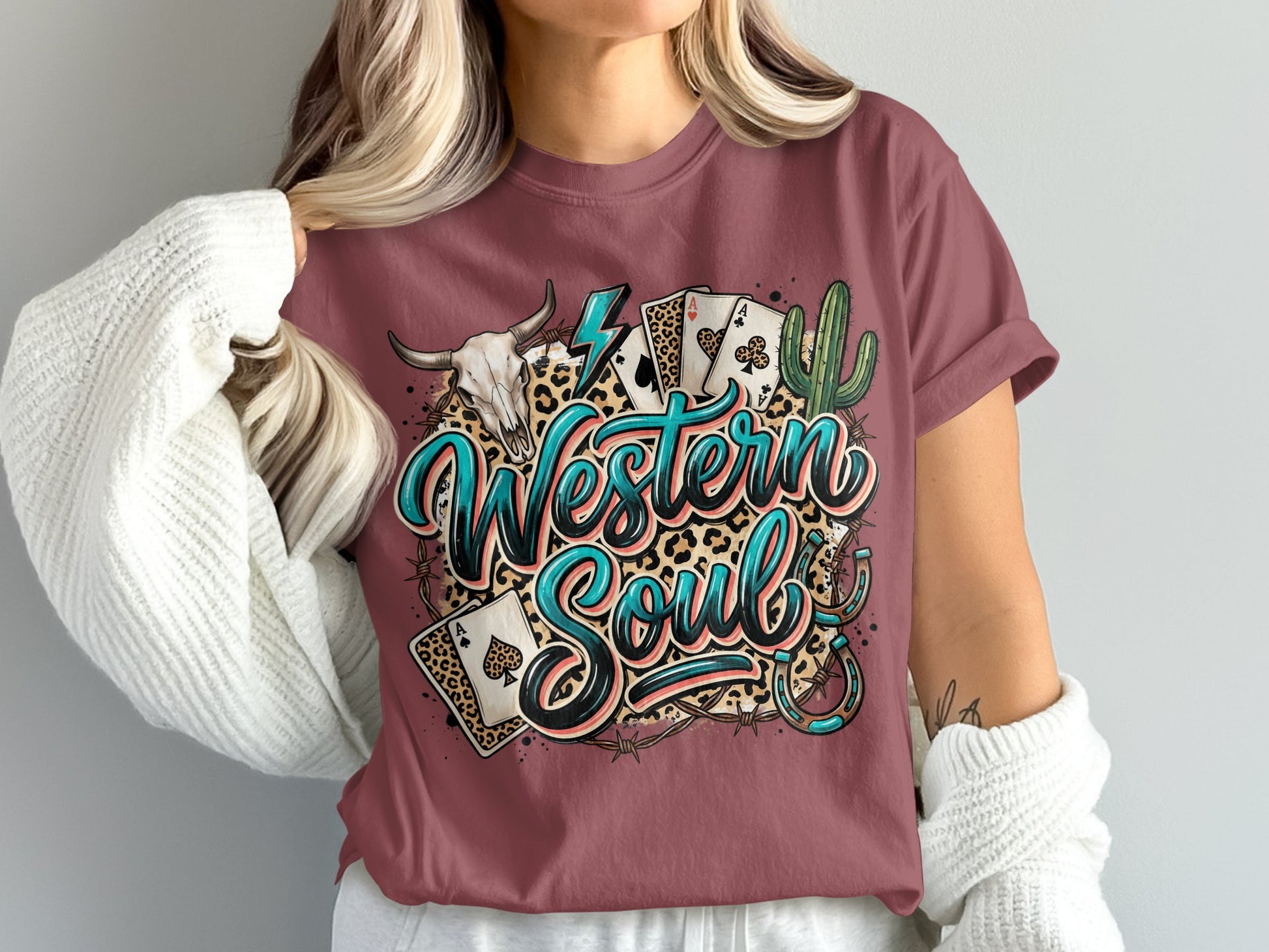 T-shirt with "Western Soul" text, cowboy skull, cards, cactus, and leopard print.