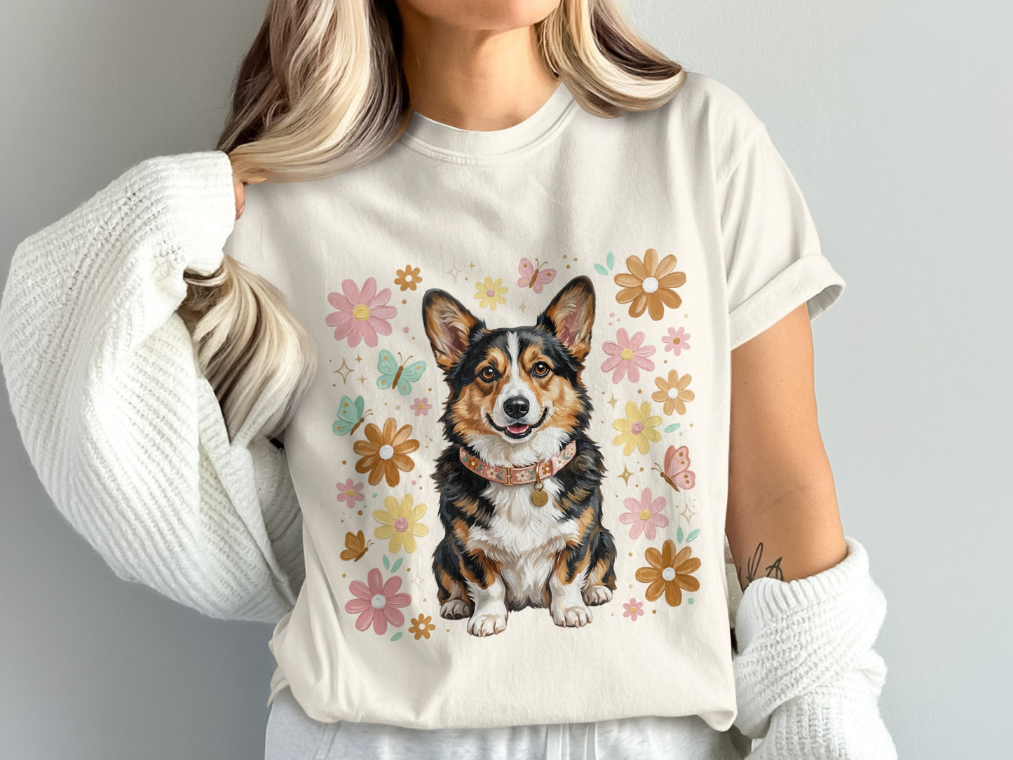 Corgi dog wearing a collar surrounded by flowers and butterflies.