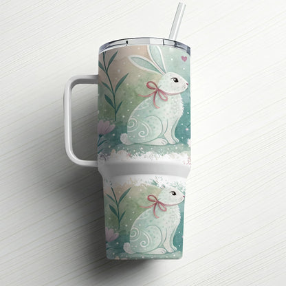 White tumbler with two pastel Easter bunnies, pink bows, and subtle floral accents.