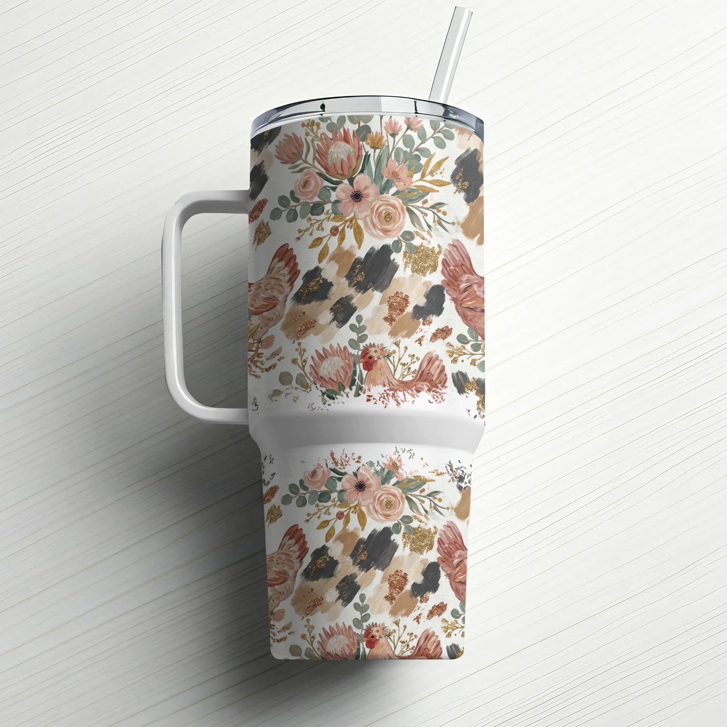 White tumbler with floral, chicken, and abstract brushstroke pattern and straw.