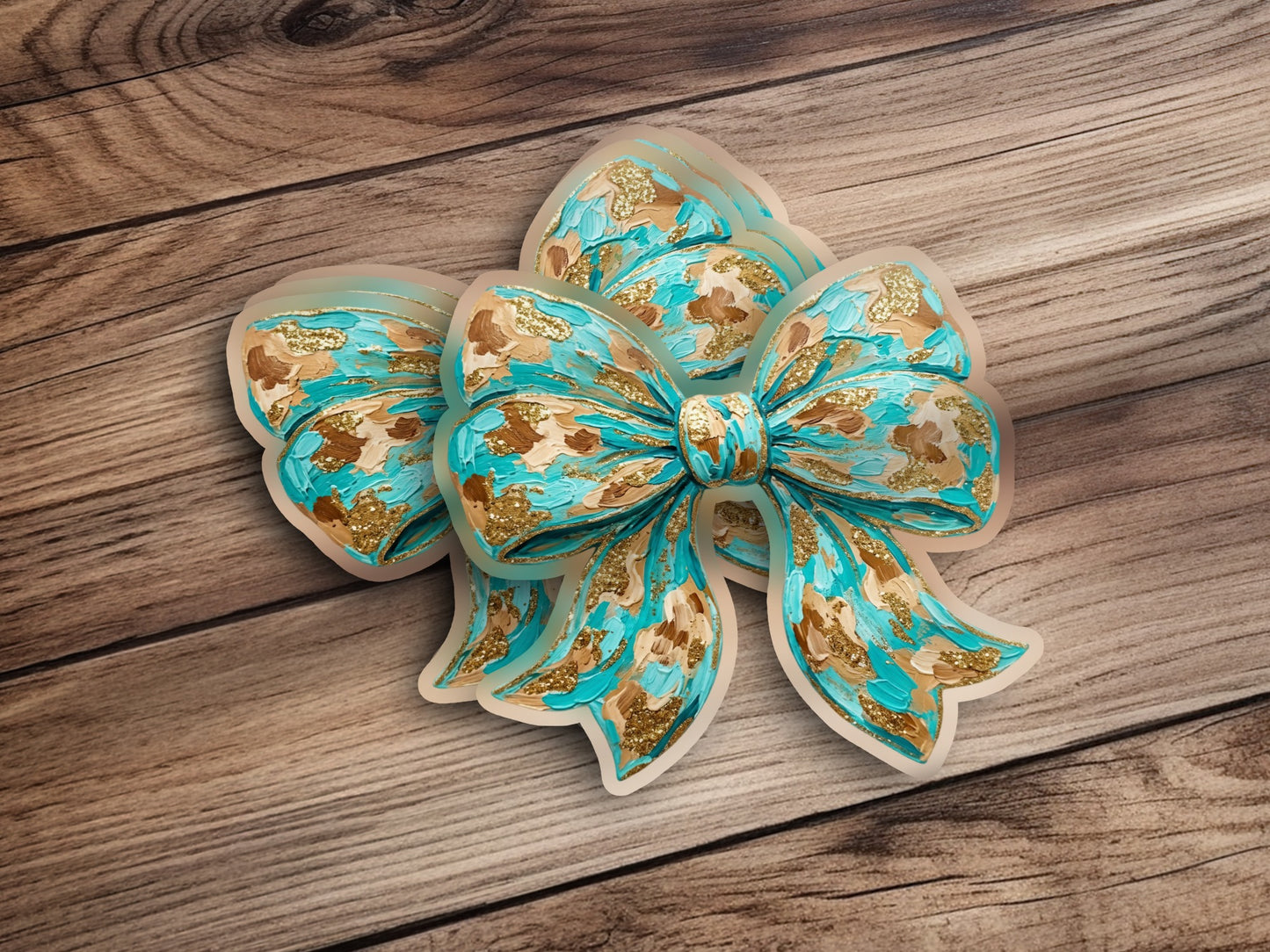 Turquoise bow with gold accents on a wooden background.