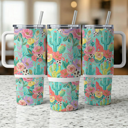 Three turquoise tumblers with floral and cactus patterns and white handles.