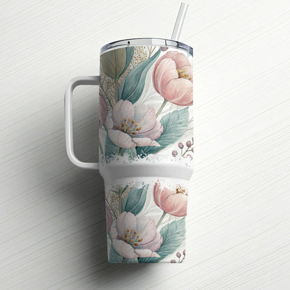 White tumbler with pink floral pattern and straw.