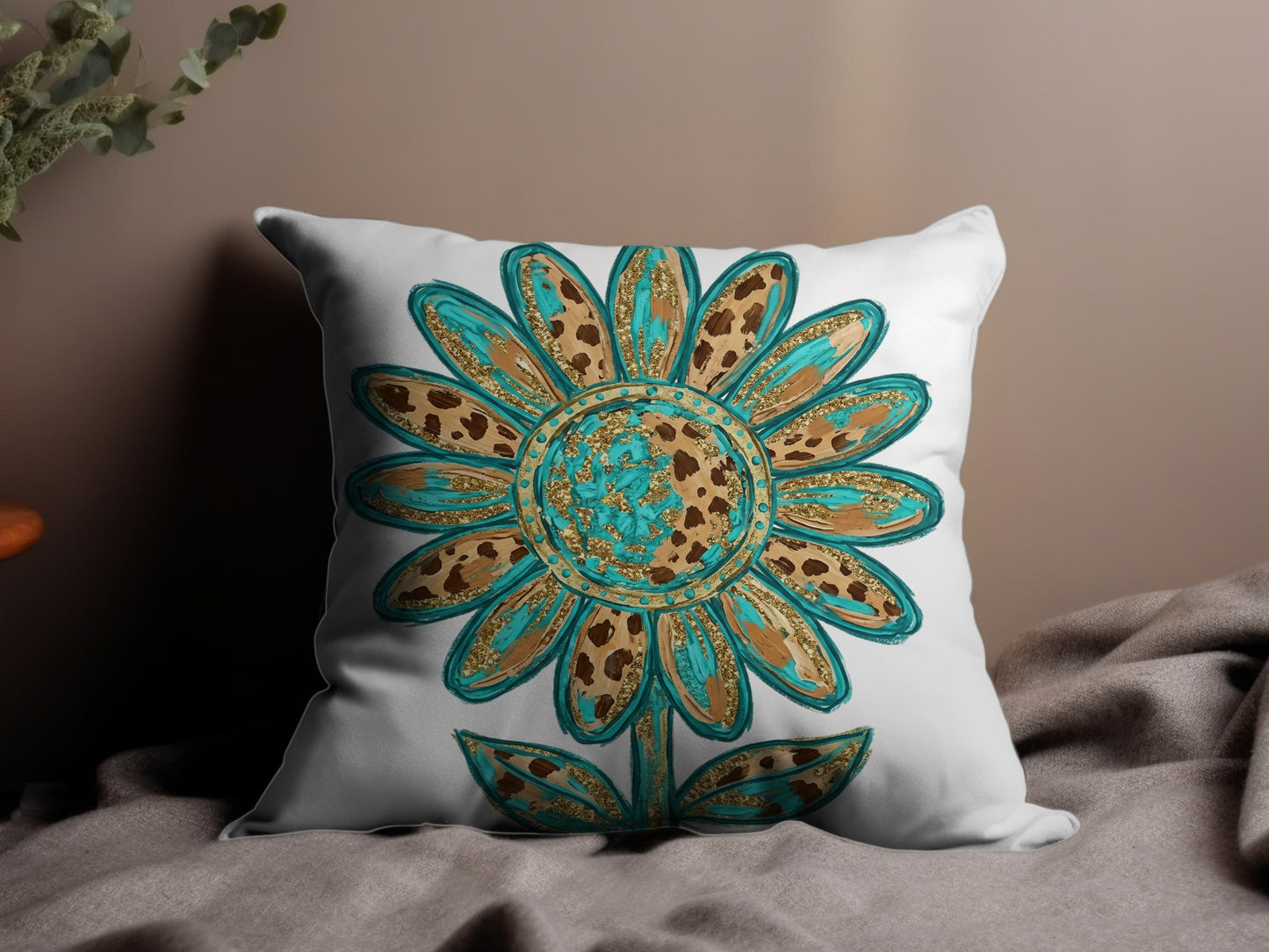 White throw pillow with turquoise and brown leopard print flower design.