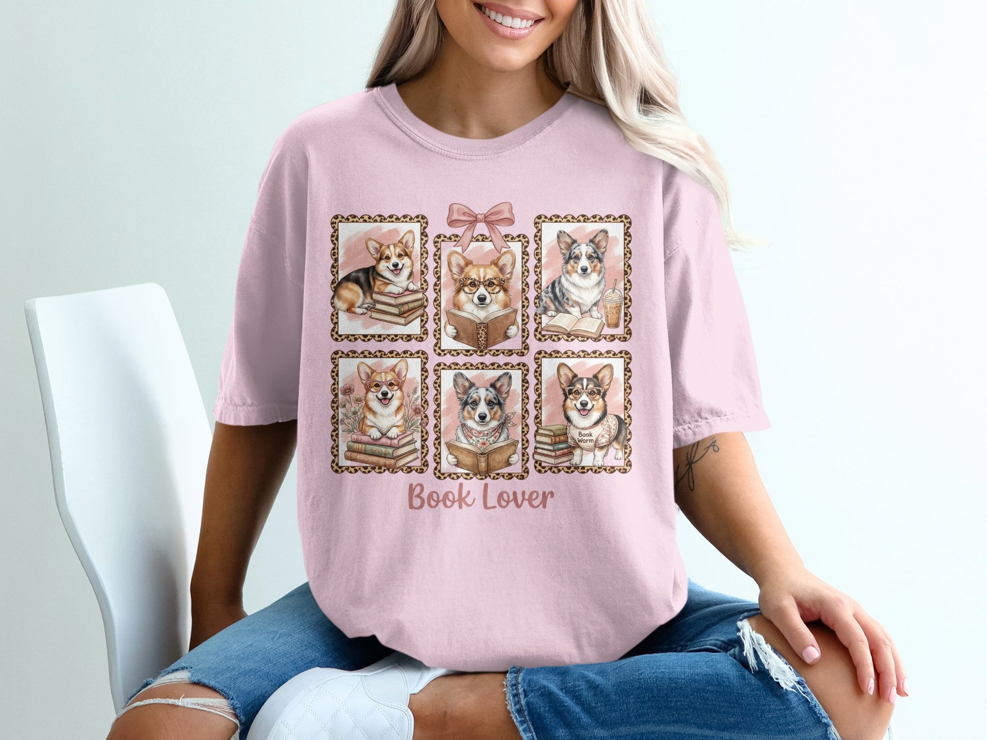Pink t-shirt with six framed corgi illustrations and "Book Lover" text.