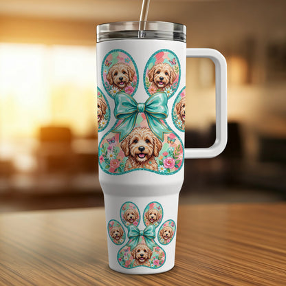 White tumbler with paw print design featuring puppy faces and floral accents.