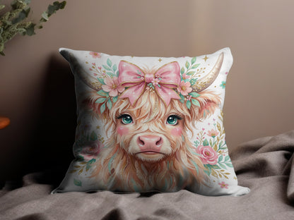 Watercolor Highland cow with flowers and pink bow, on a pillow.