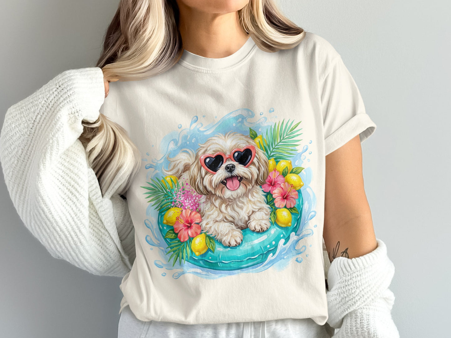 Cream t-shirt with a dog wearing heart sunglasses in a pool float.