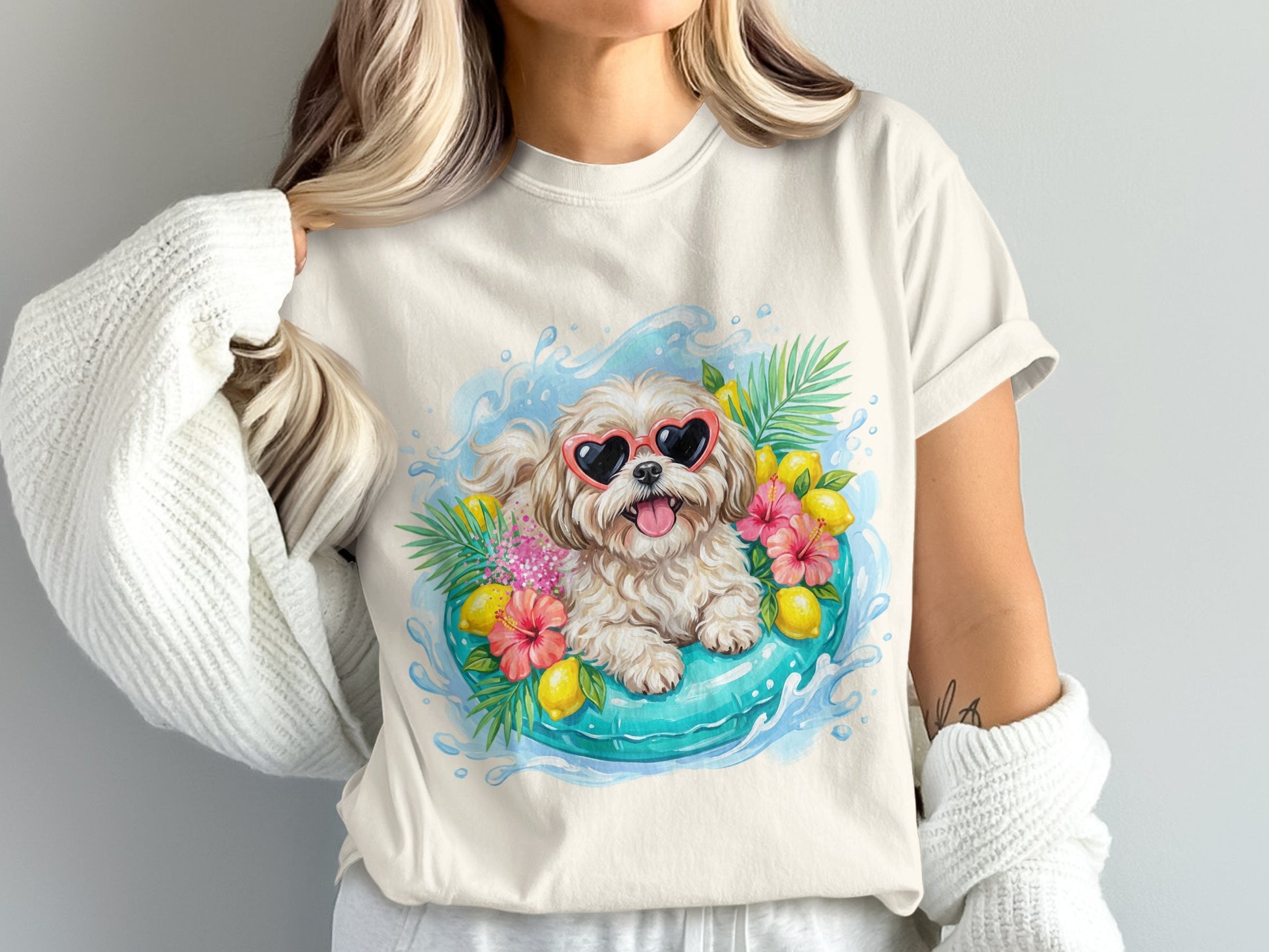 Cream t-shirt with a dog wearing heart sunglasses in a pool float.