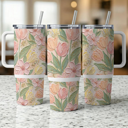 Three identical tumblers with a pastel floral tulip pattern and handles.
