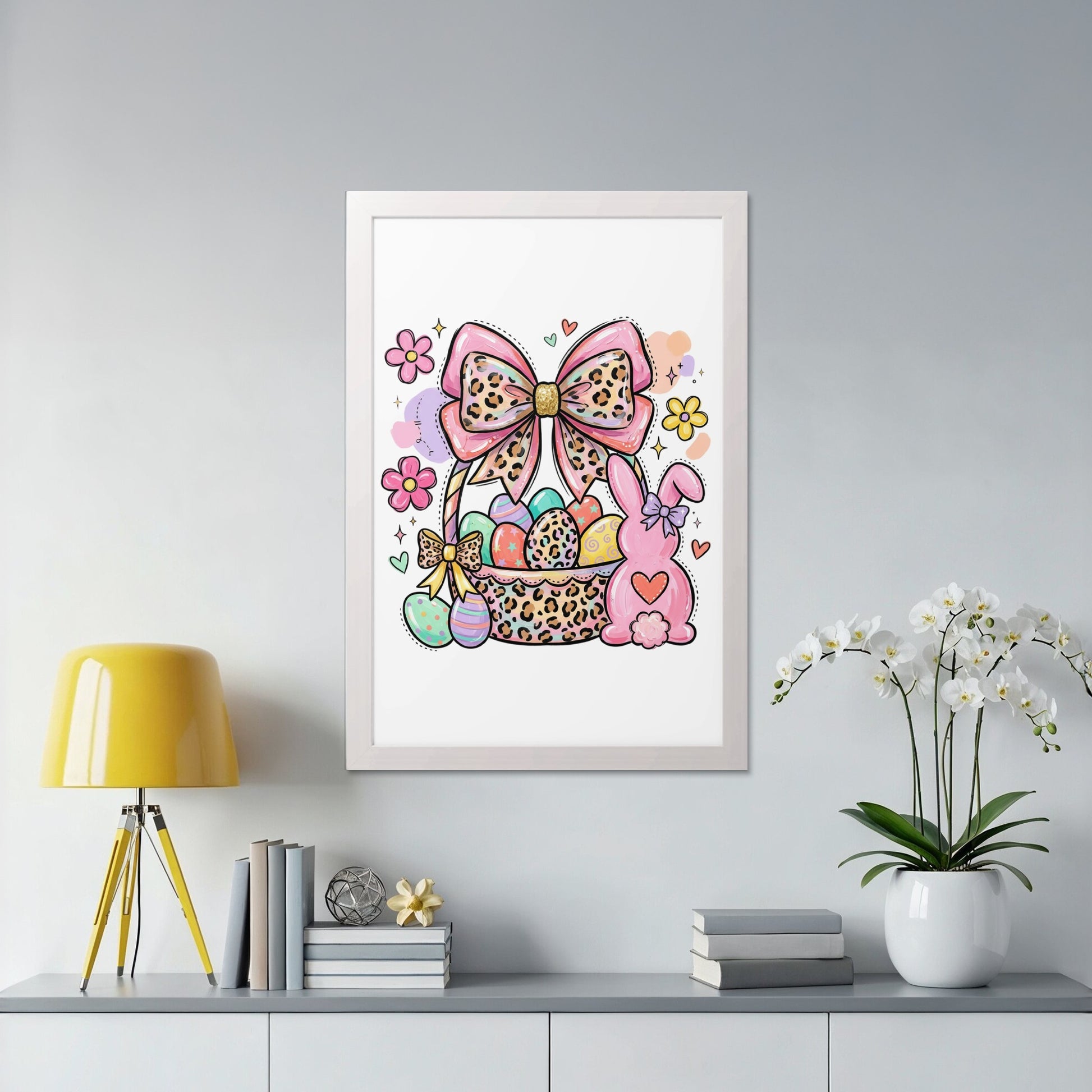Easter basket with colorful eggs, bunny, and bow, framed on a wall.
