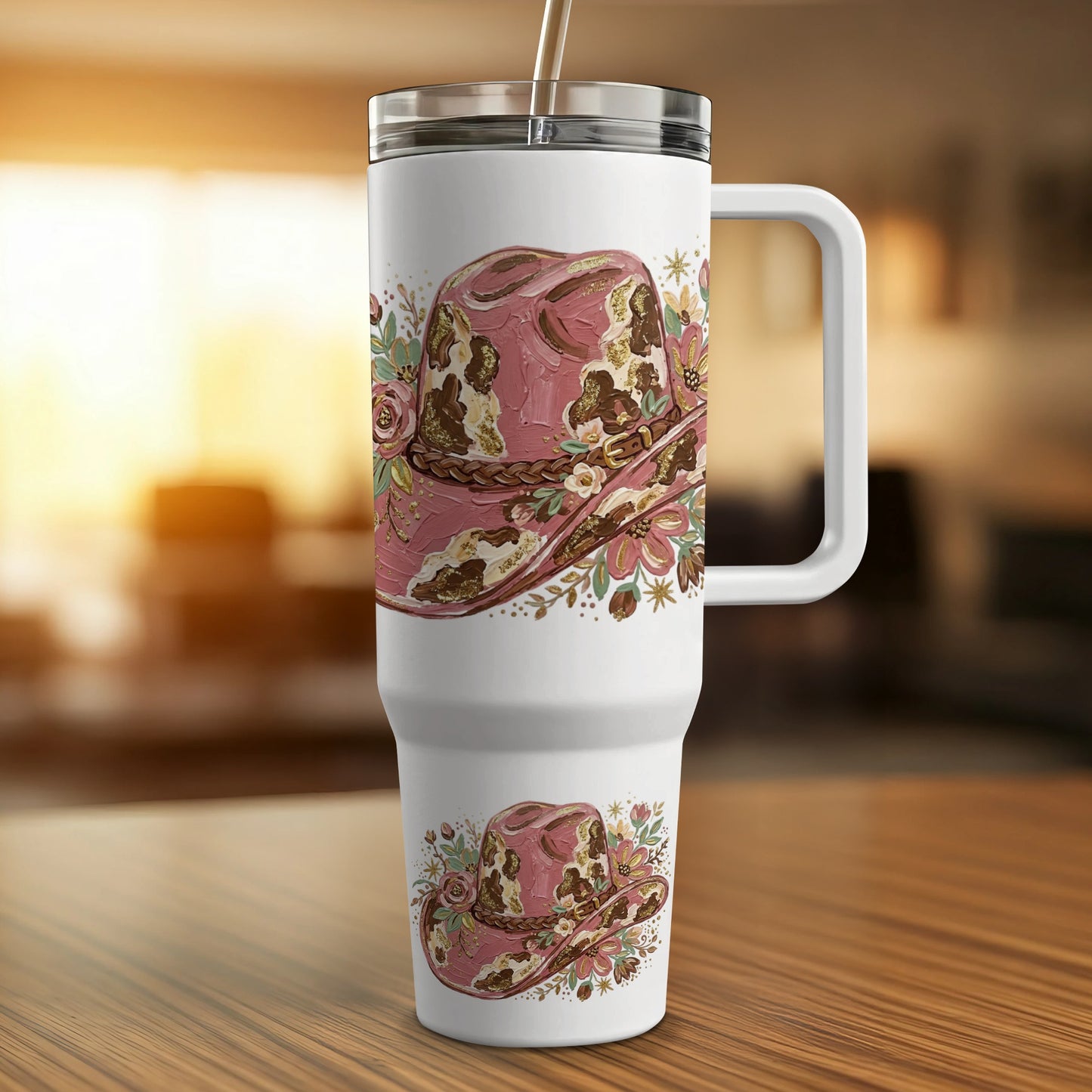 White tumbler with a pink and brown distressed cowboy hat floral design.