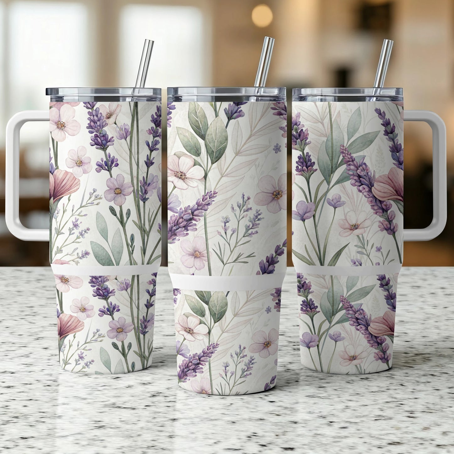 Three insulated tumblers with floral and lavender designs and white handles.