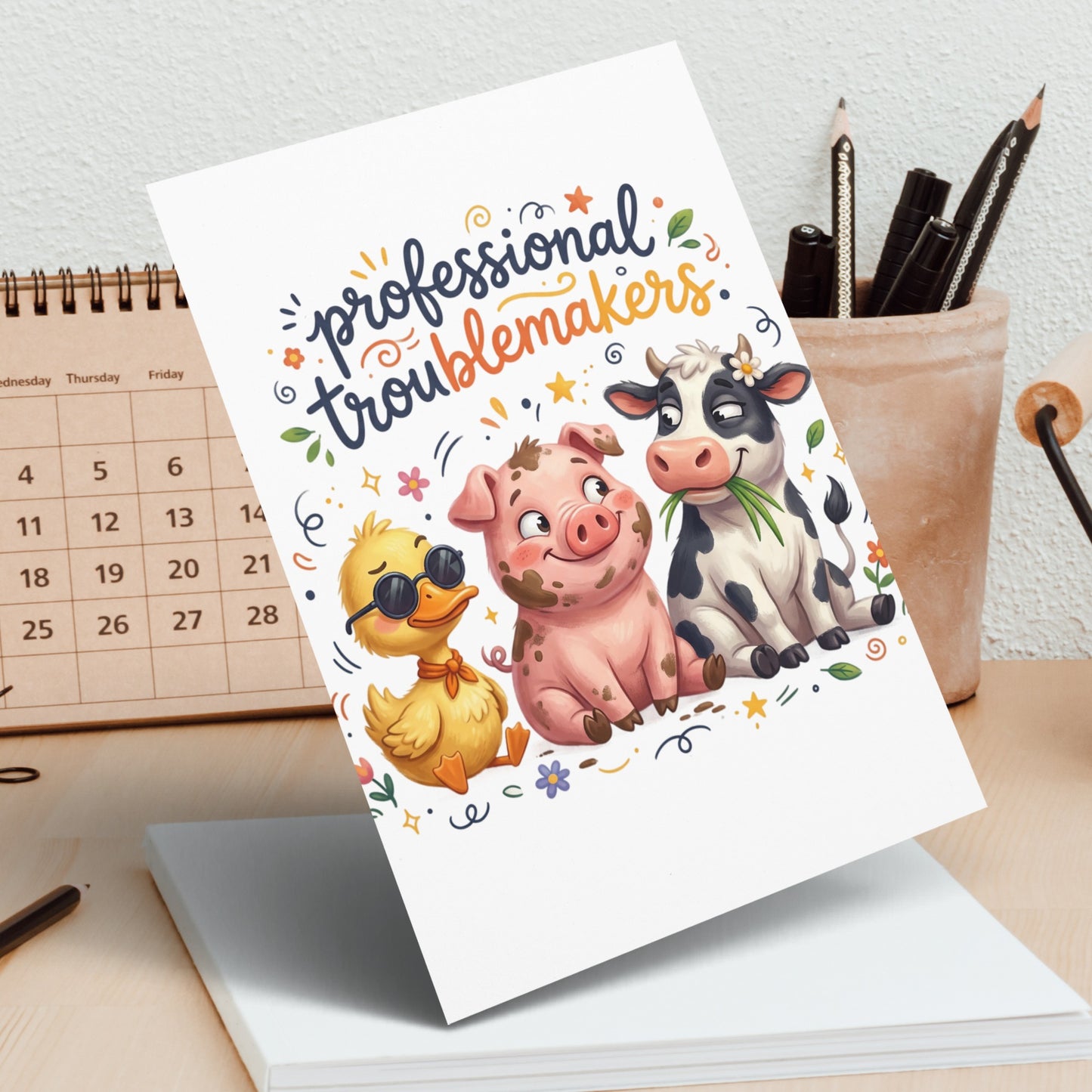 Card with cartoon pig, duck, and cow reading "professional troublemakers".