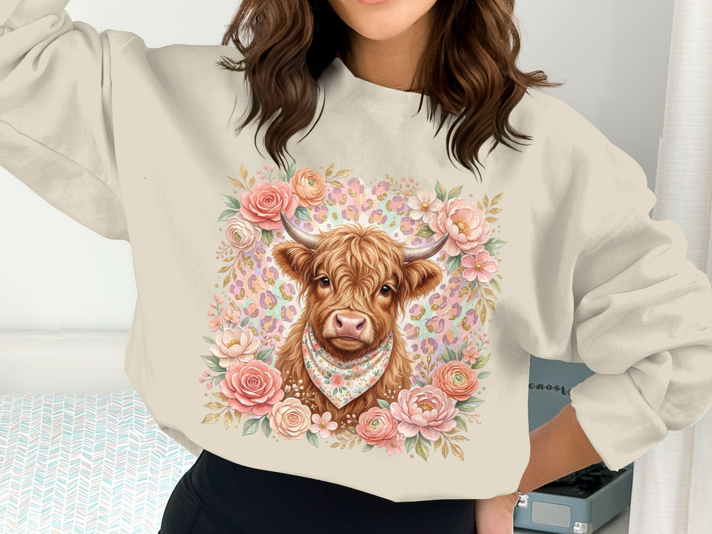 Sweatshirt with a Highland cow wearing a bandana, surrounded by flowers and leopard print.