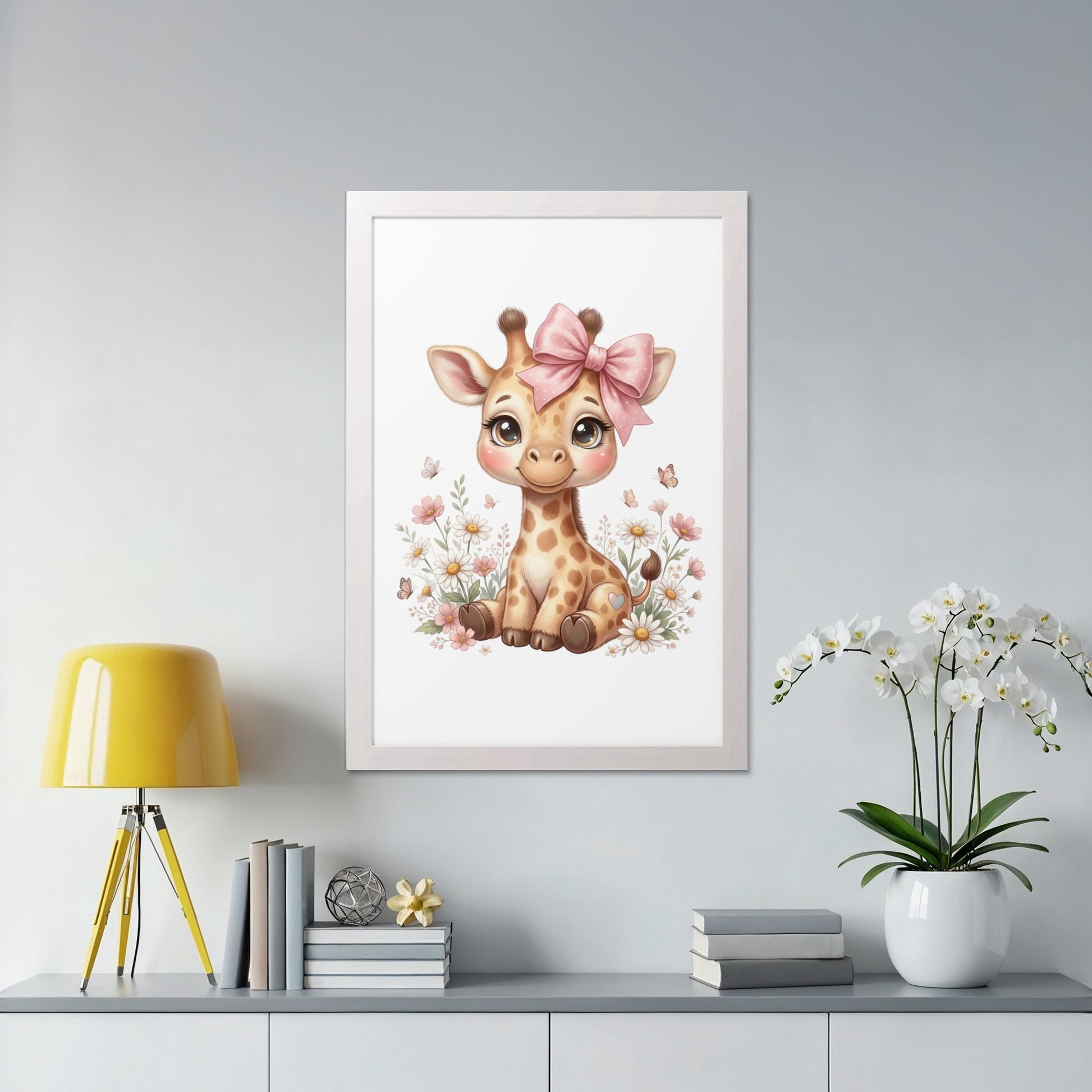 Framed watercolor art of a cute baby giraffe with a pink bow.
