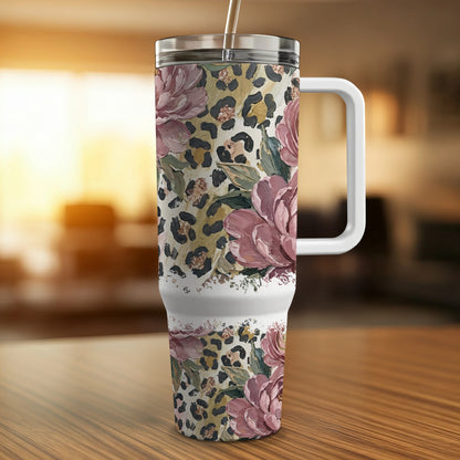 Tumbler with floral and leopard print design and white handle.