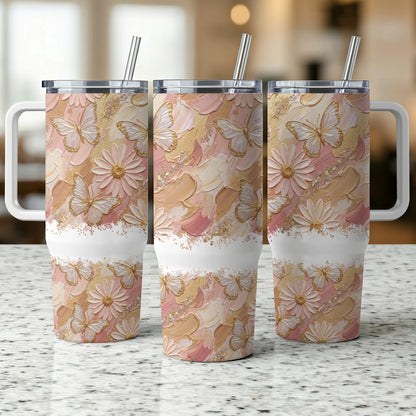 Three pastel butterfly and floral patterned tumblers with handles and straws.