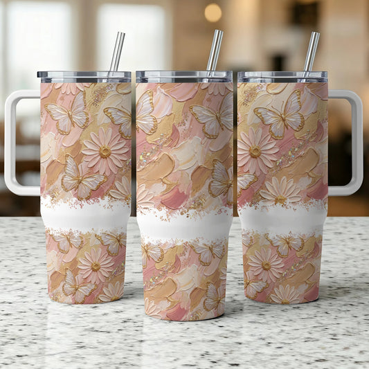 Three pastel butterfly and floral patterned tumblers with handles and straws.