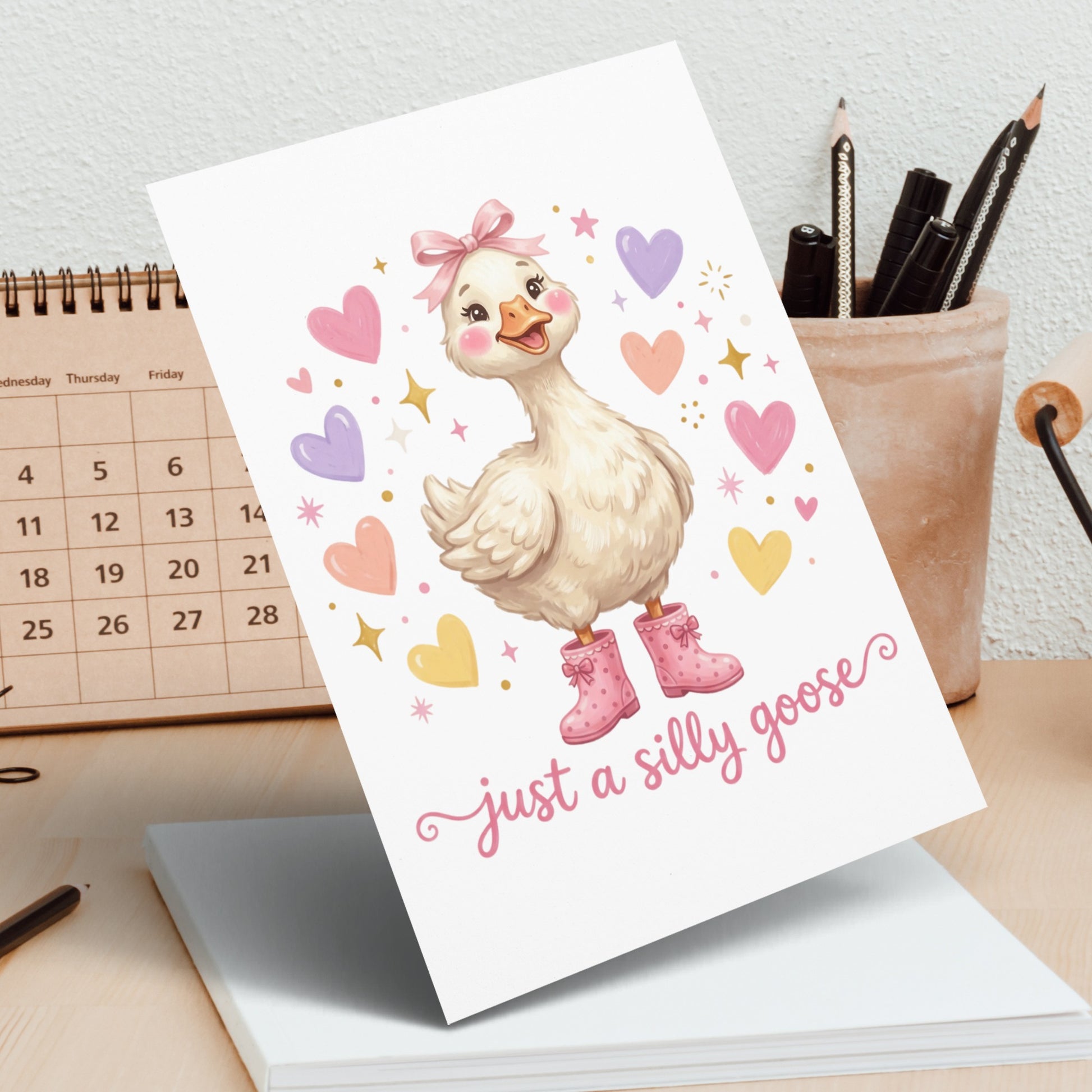 Cute goose with pink bow and boots, "just a silly goose" text.
