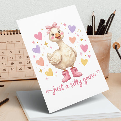 Cute goose with pink bow and boots, "just a silly goose" text.