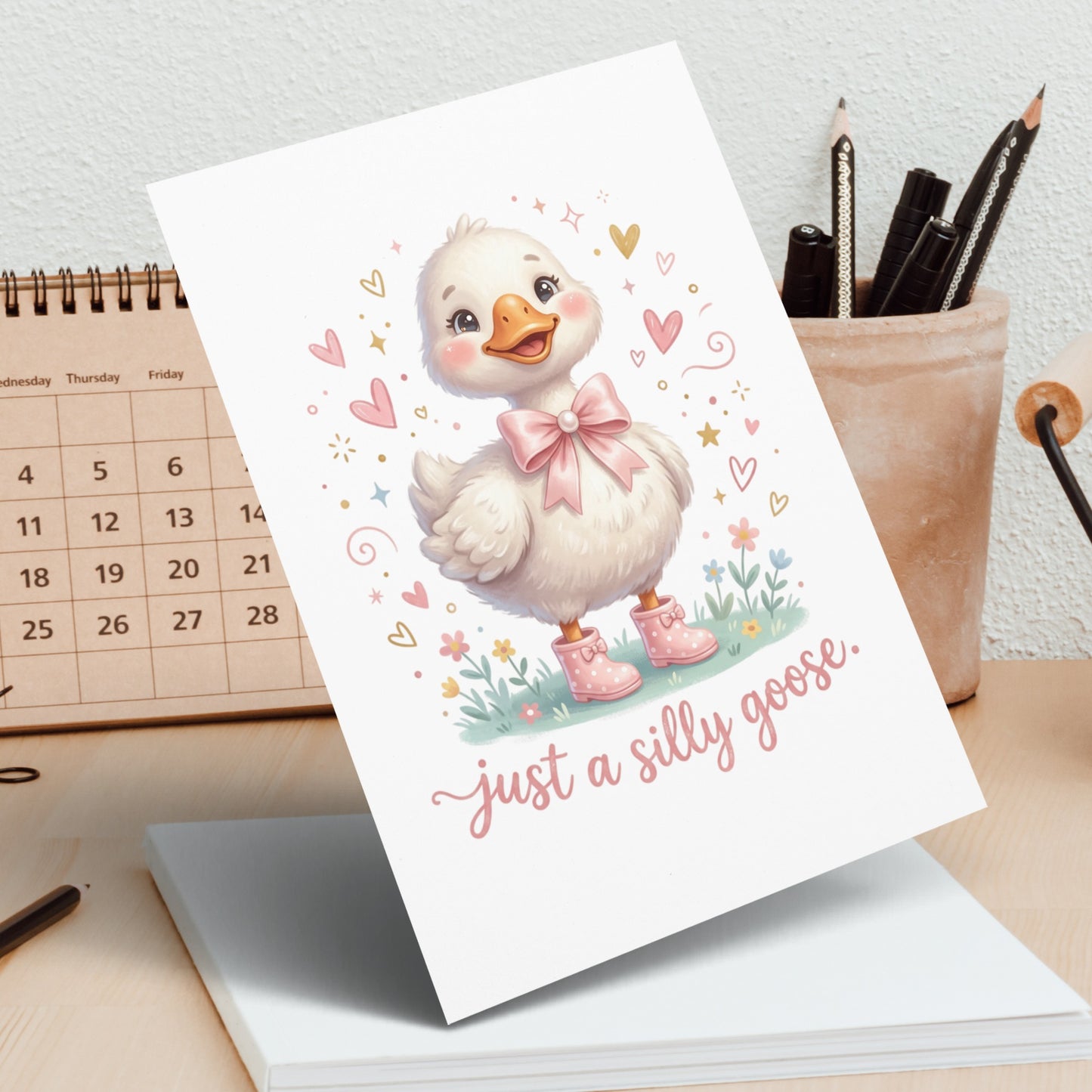 Cute goose illustration with pink bow and boots, "just a silly goose" text.