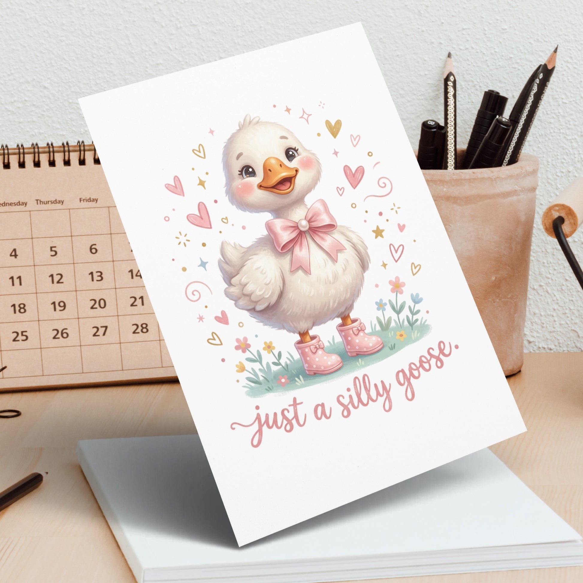 Cute goose illustration with pink bow and boots, "just a silly goose" text.