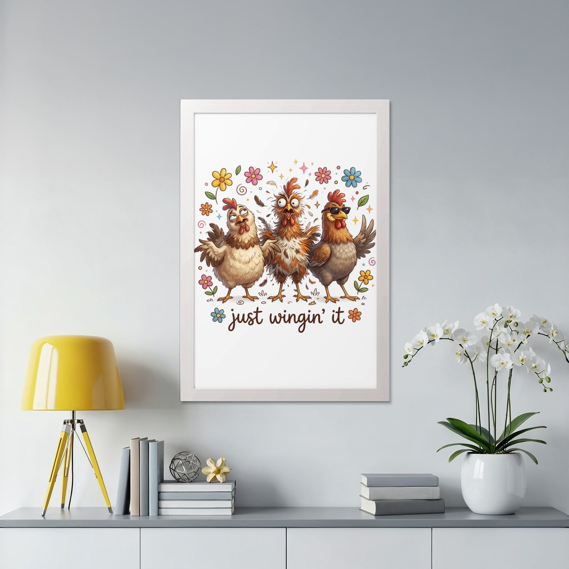Three cartoon chickens with flowers and text "just wingin' it" in a framed picture.