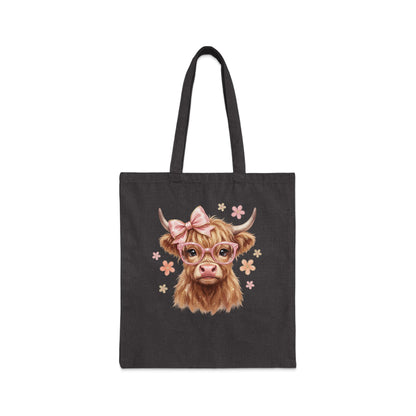 Highland cow with glasses and bow on dark tote bag.