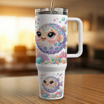 White tumbler with cute pufferfish, bubbles, and coral designs.