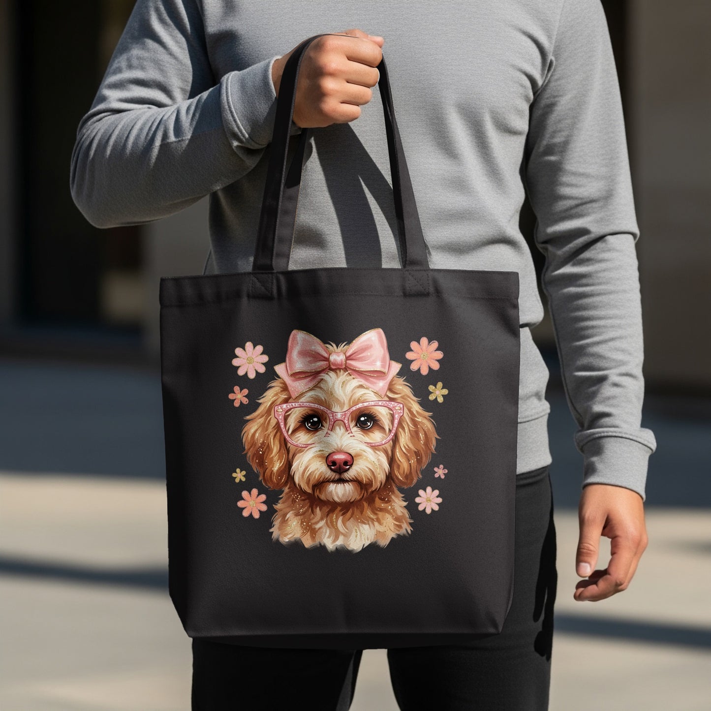 Black tote bag featuring a cartoon poodle wearing pink glasses and a bow.
