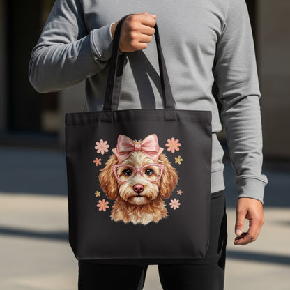 Black tote bag featuring a cartoon poodle wearing pink glasses and a bow.