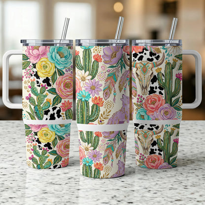 Three floral and cactus patterned tumblers with handles and straws.