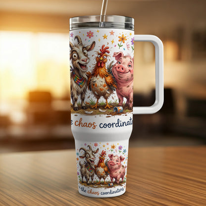 White tumbler with cartoon goats and pigs, "Chaos Coordinators" text.
