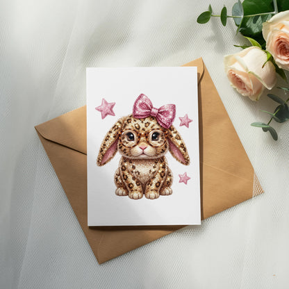 Cute leopard print bunny with glasses and pink bow on greeting card.
