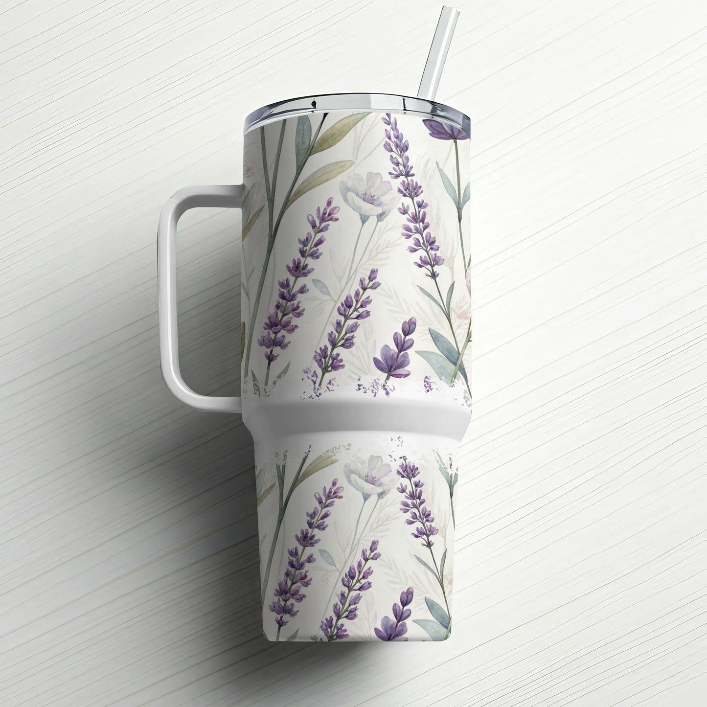 White tumbler with a lavender floral pattern and a straw.