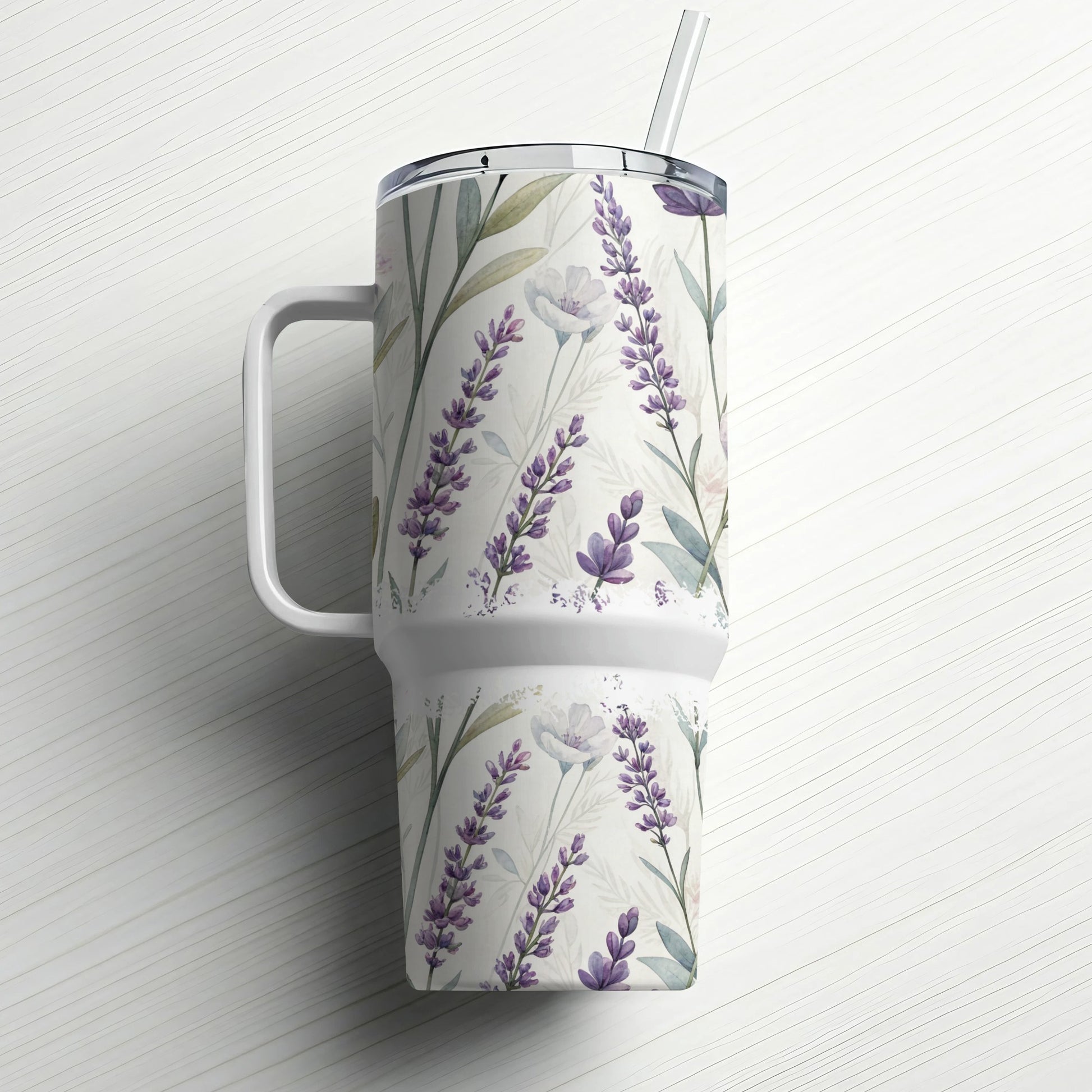 White tumbler with a lavender floral pattern and a straw.