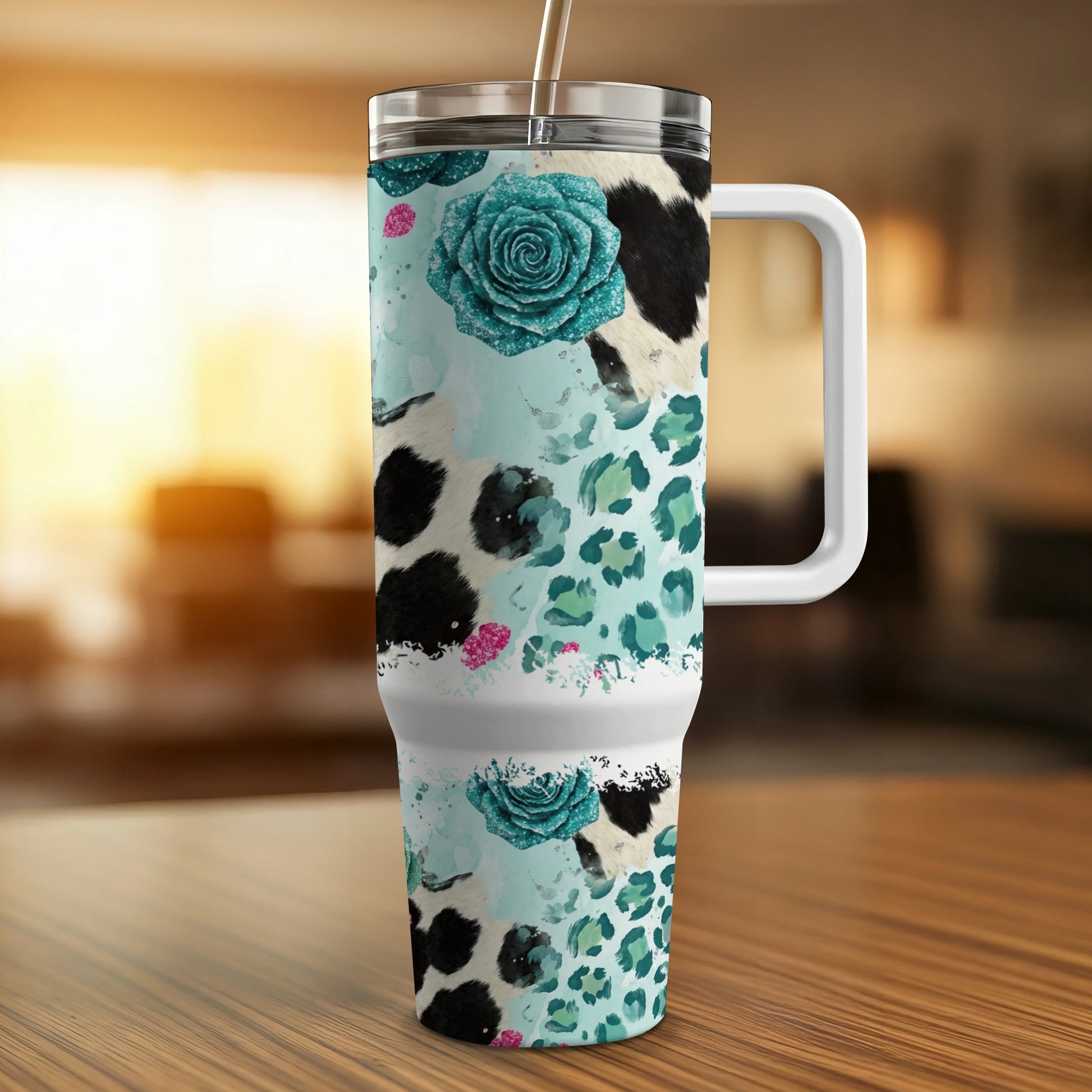 Large insulated tumbler with cow print, leopard print, and teal floral design.