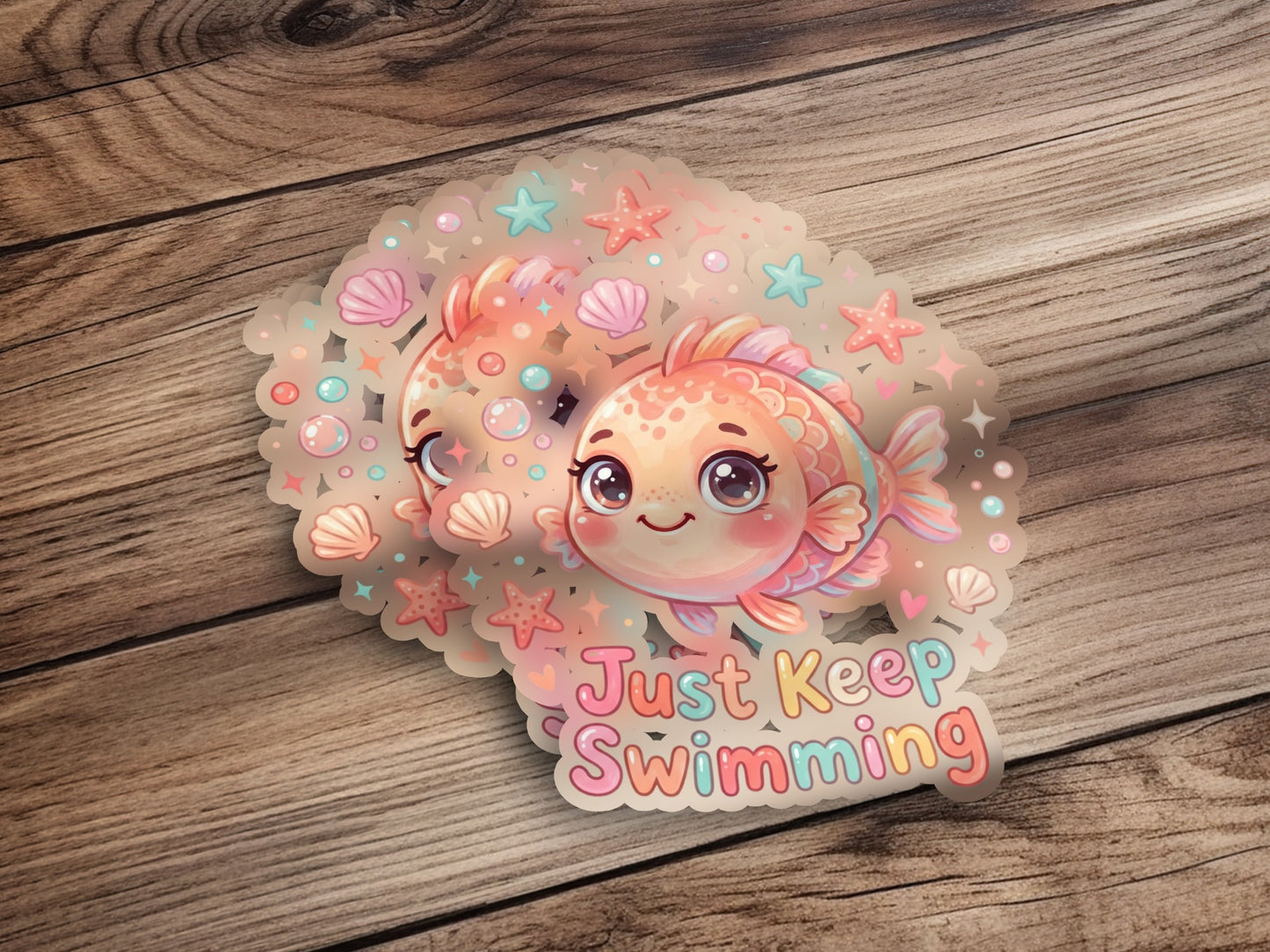 Two cute fish stickers with "Just Keep Swimming" text on wood.