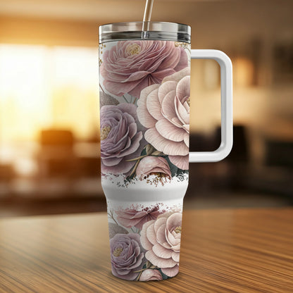 Floral patterned tumbler with handle and straw.