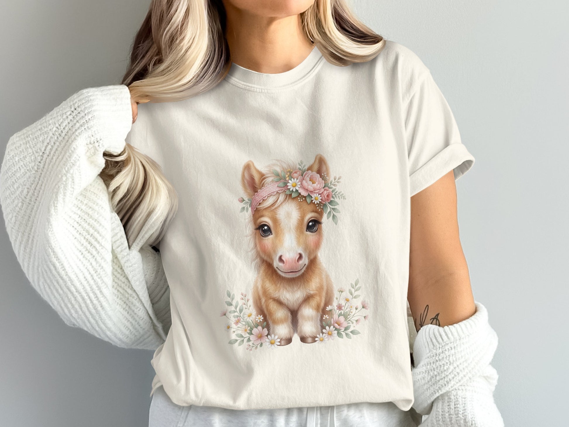 Cream t-shirt with a cute baby horse wearing a flower crown.