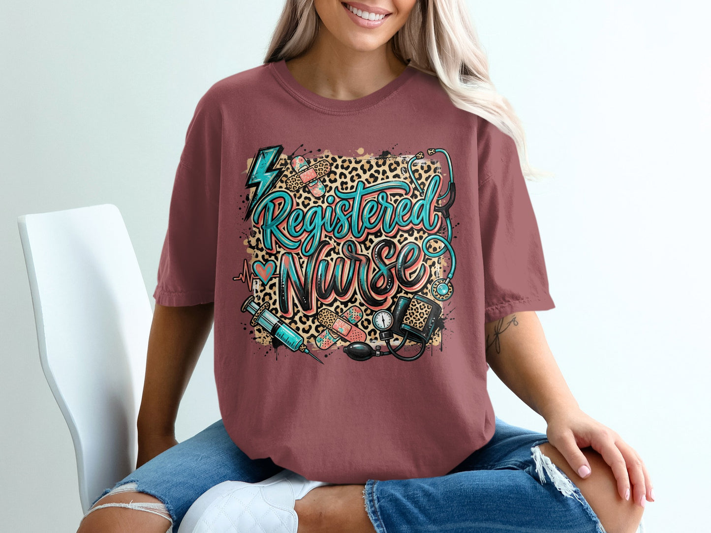 Registered Nurse graphic tee with stethoscope, syringe, and leopard print.