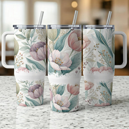 Three tumblers with a floral pattern of pink and purple tulips and green leaves.