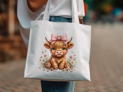 Tote bag with a cute Highland cow graphic and pink bow.
