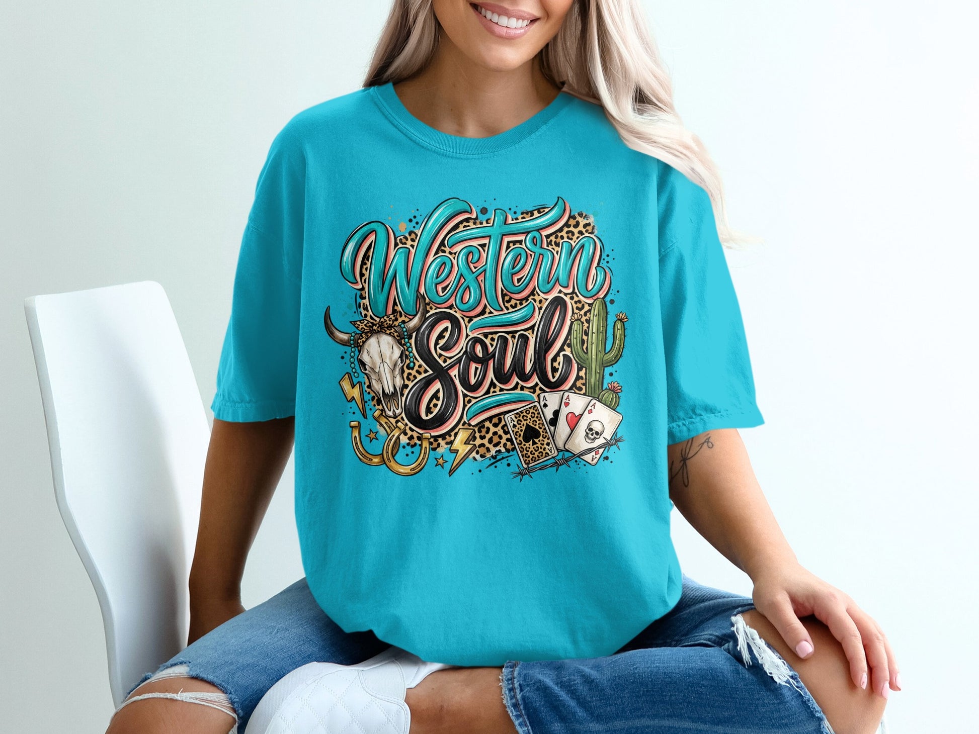 Teal t-shirt with "Western Soul" text, skull, playing cards, and horseshoes.