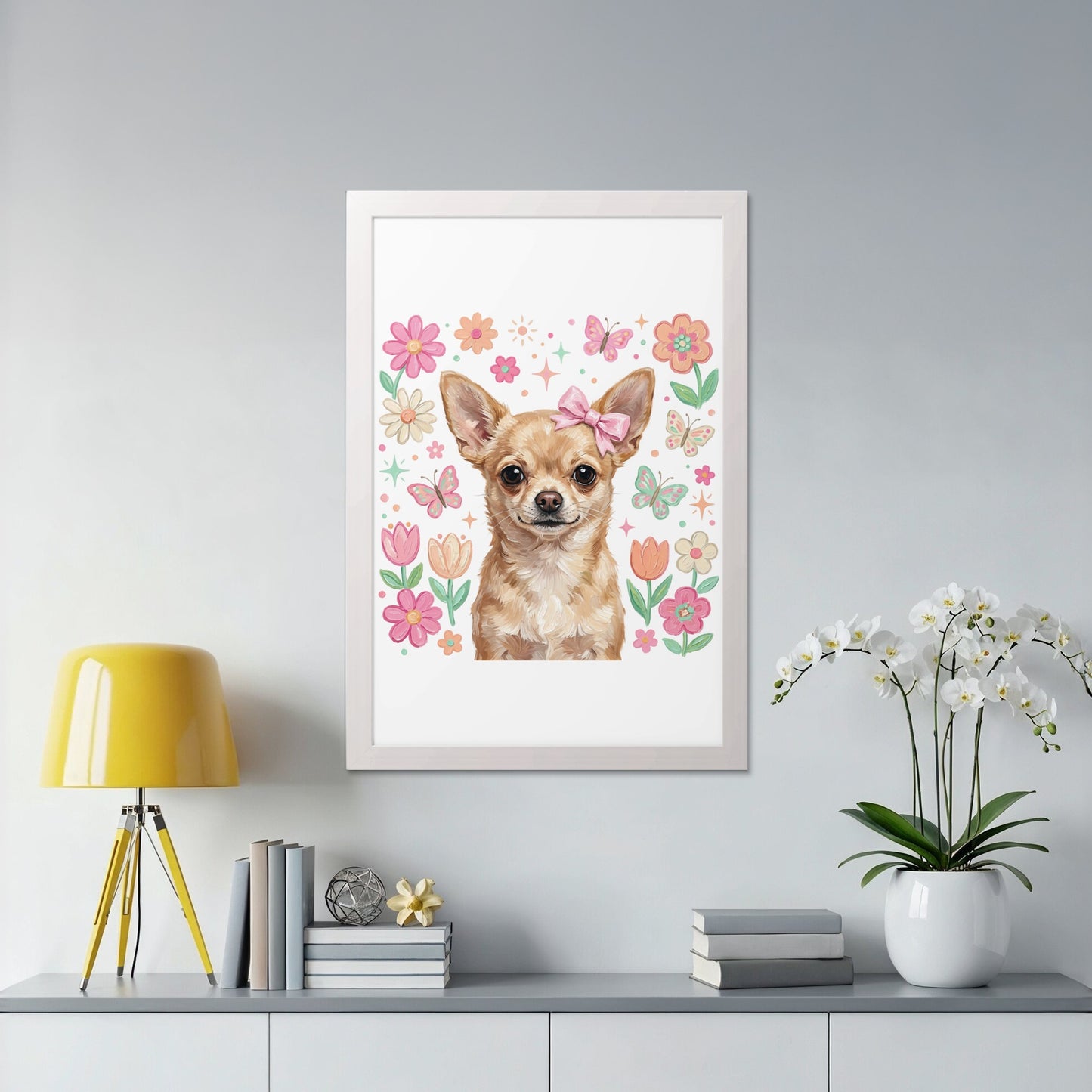 Chihuahua with pink bow and floral border in a white frame.