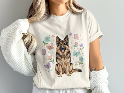 German Shepherd dog with butterflies and flowers on a cream t-shirt.
