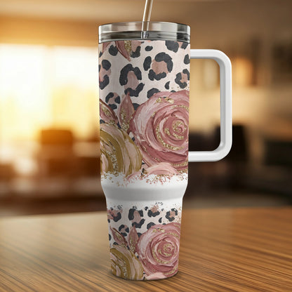 Floral and leopard print tumbler with white handle and straw.